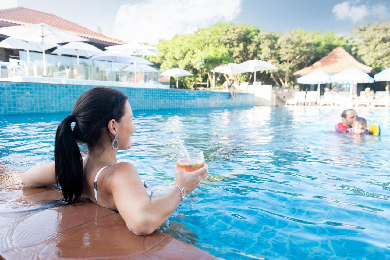 Hotel The Capital Zimbali Ballito Zewnętrze zdjęcie A woman relaxing at a pool